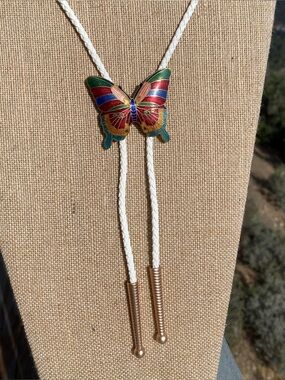 Bolo tie repurposed butterfly cloisonné belt buckle, new cord and tips.